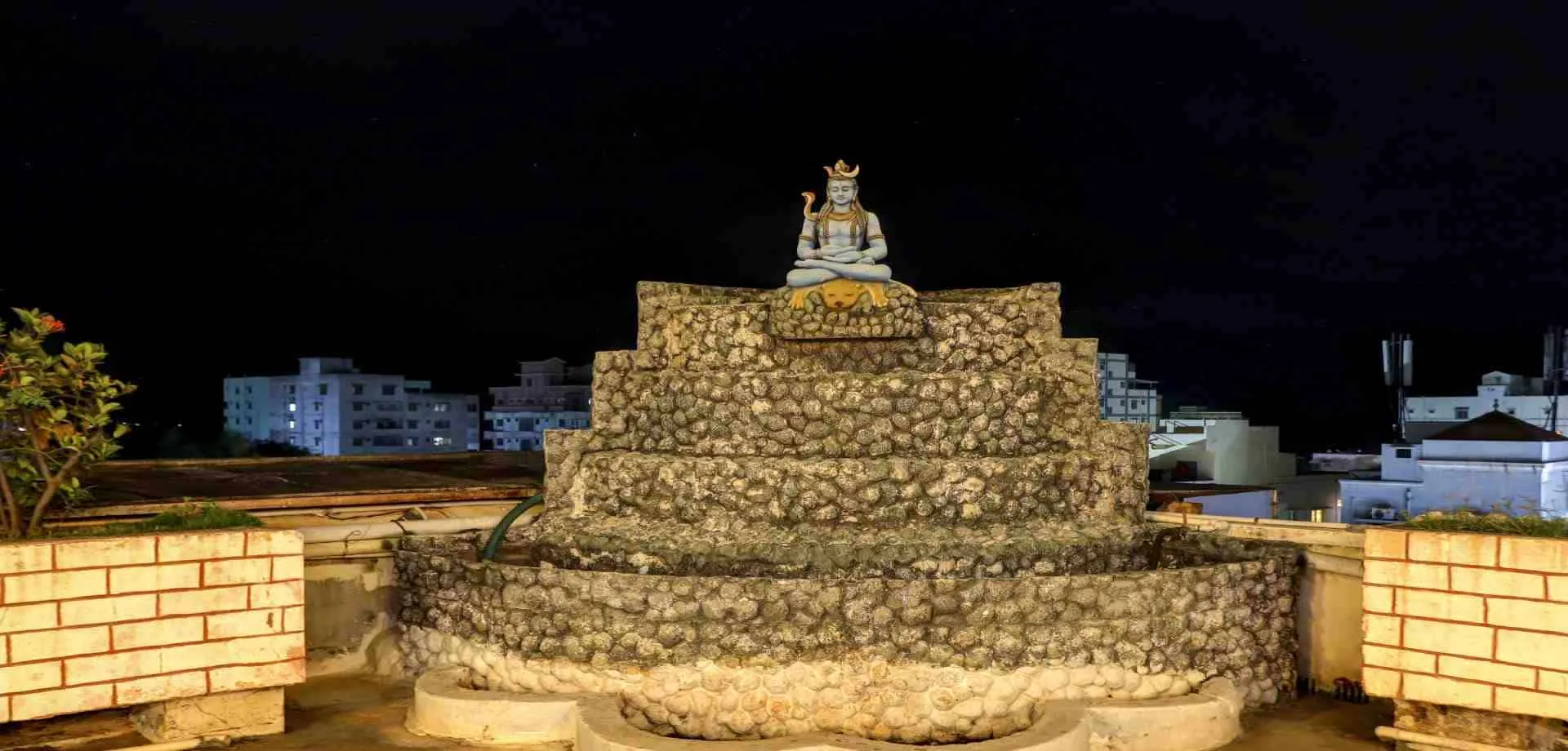 Sri Sai Sadan rooftop at night